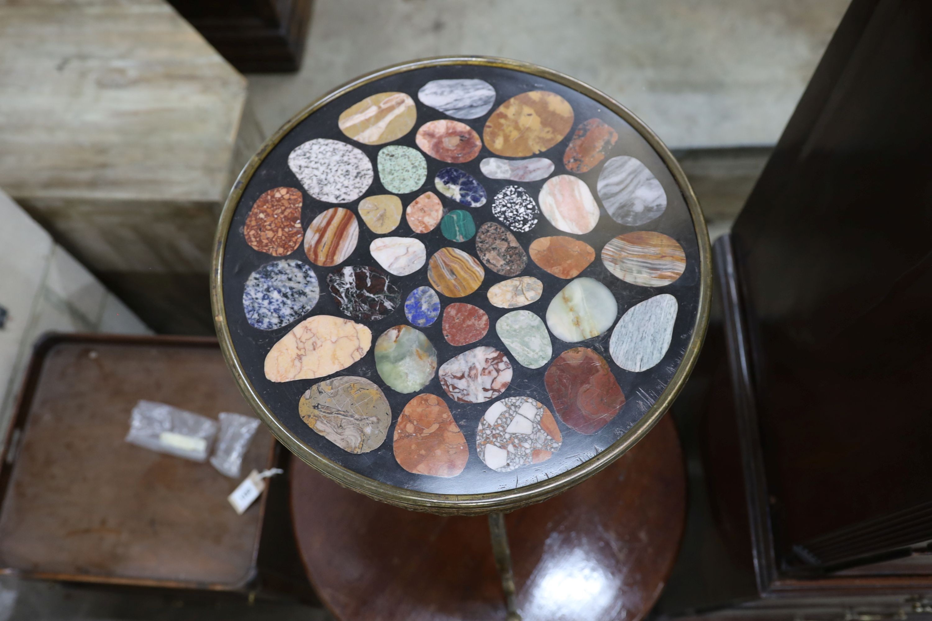 A circular brass and specimen marble tripod table, top diameter 40cm, height 71cm